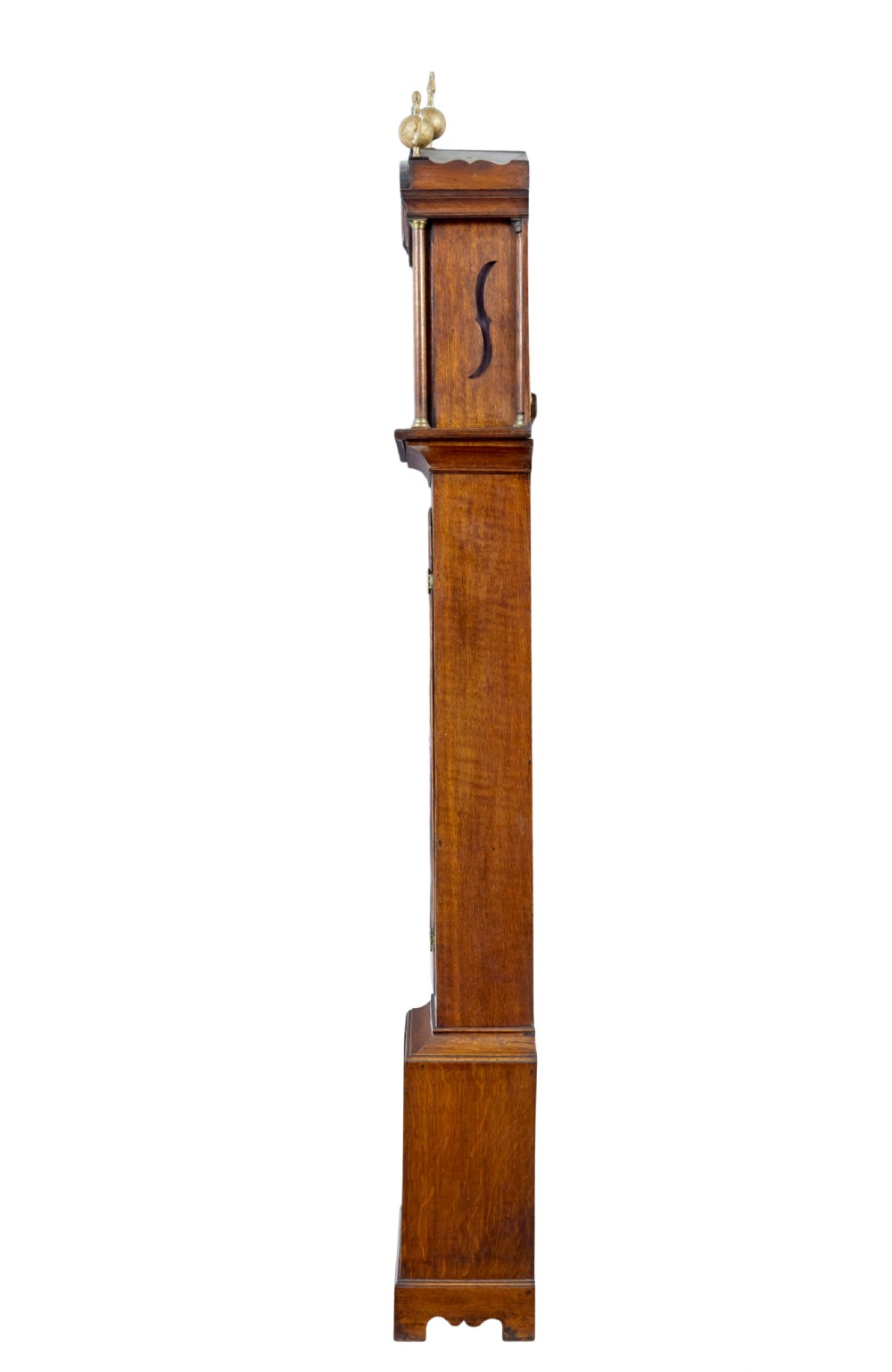 An 18th-century oak longcase clock featuring a brass dial, pediment hood with brass finials, rectangular trunk door, and plinth base. View III