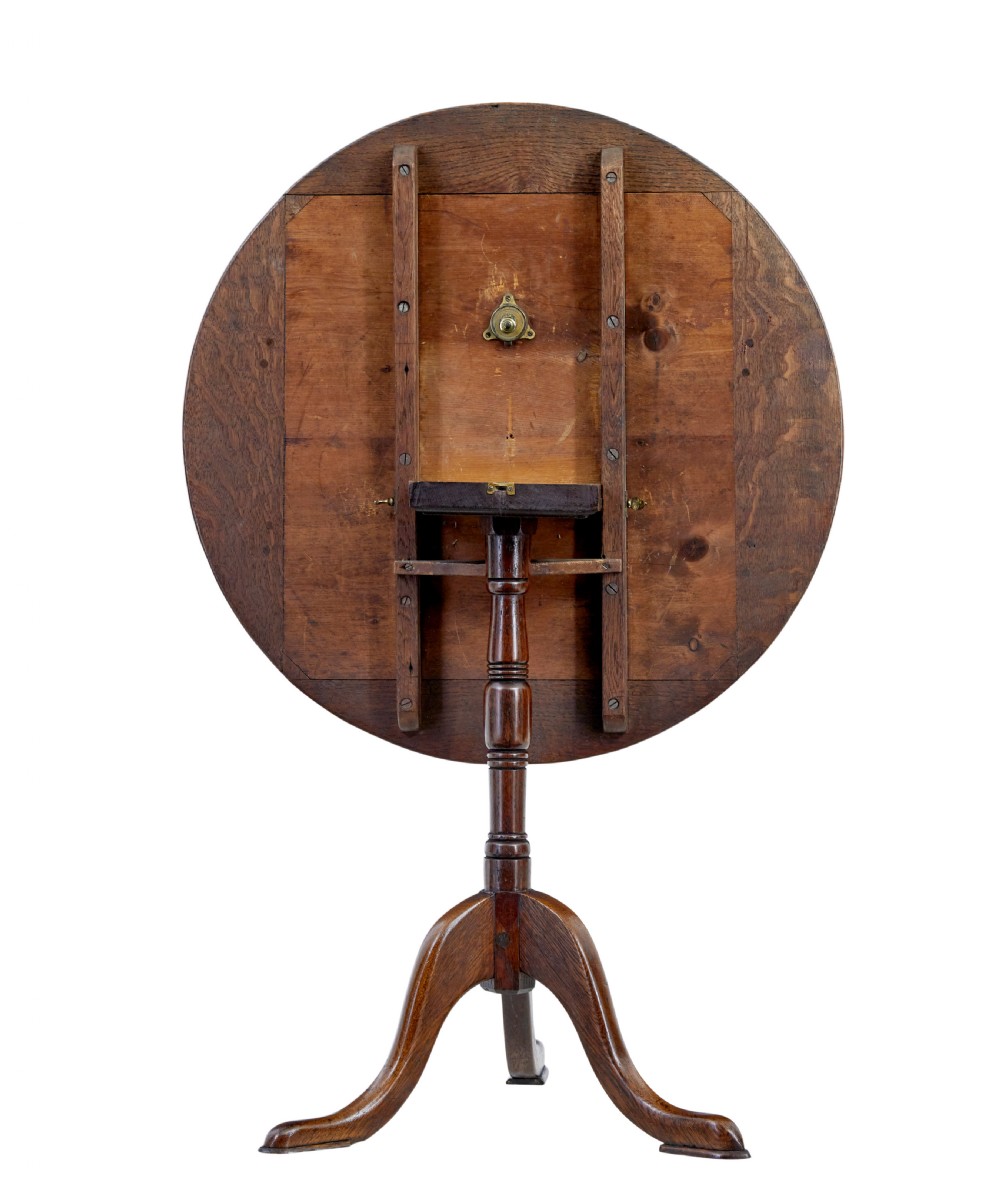 A 19th-century round oak occasional table featuring a geometric inlaid wood top, a turned central pedestal, and three splayed legs. View III