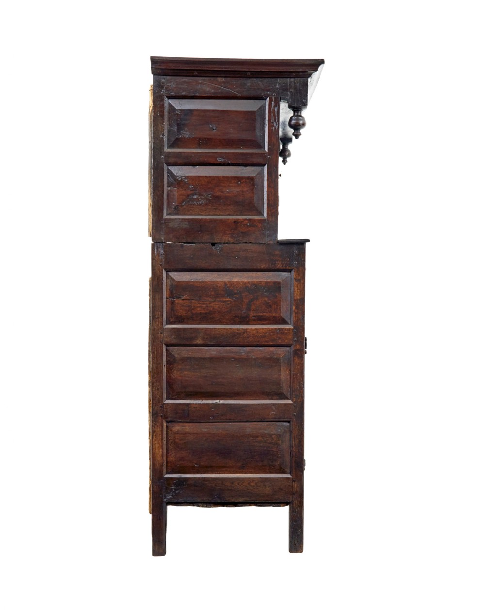 A seventeenth-century dark oak Welsh court cupboard featuring raised geometric panels, turned pendant drops, small central drawers, and double lower doors. View VI