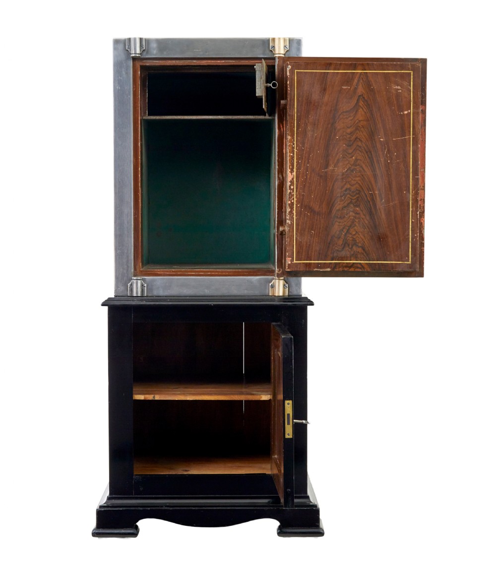 A 19th-century Danish polished steel safe with brass details mounted on a black painted wooden cabinet base. View III