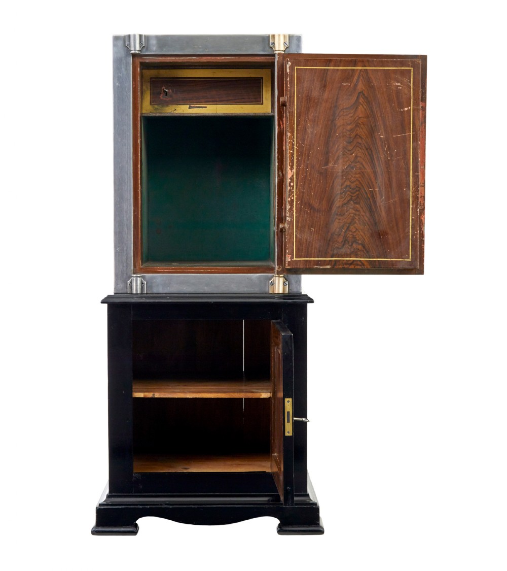 A 19th-century Danish polished steel safe with brass details mounted on a black painted wooden cabinet base. View IV