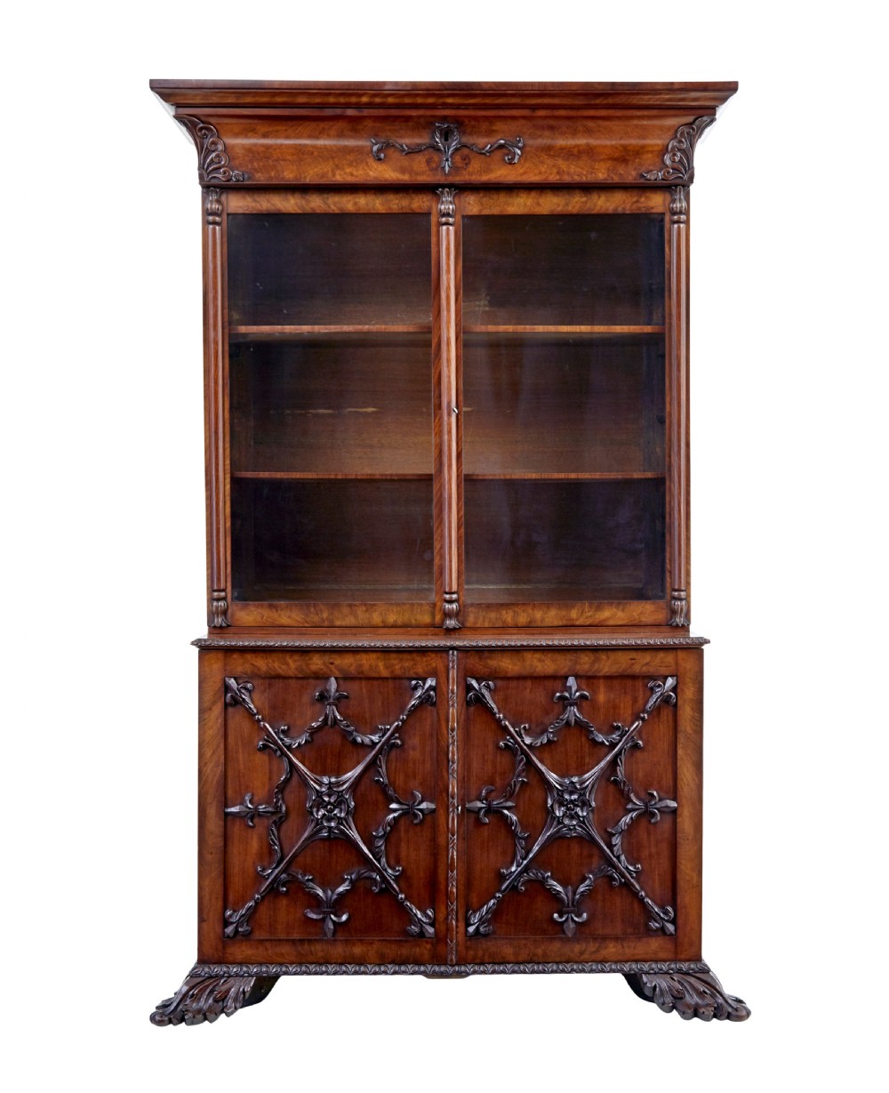 A mid-19th century Danish mahogany bookcase featuring a glazed upper display cabinet and lower doors with elaborate relief carvings. View III