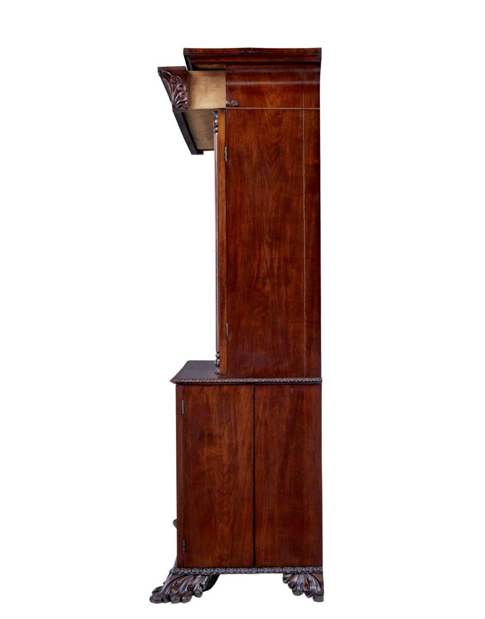 A mid-19th century Danish mahogany bookcase featuring a glazed upper display cabinet and lower doors with elaborate relief carvings. View VII