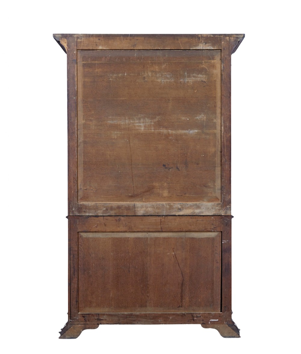 A mid-19th century Danish mahogany bookcase featuring a glazed upper display cabinet and lower doors with elaborate relief carvings. View VIII