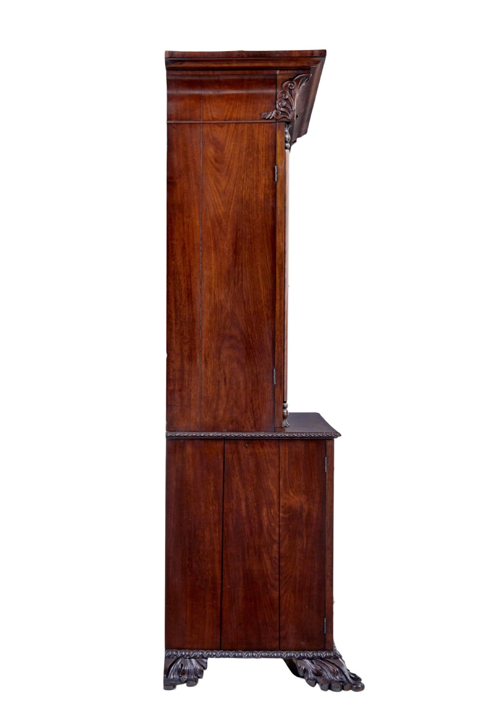A mid-19th century Danish mahogany bookcase featuring a glazed upper display cabinet and lower doors with elaborate relief carvings. View IX