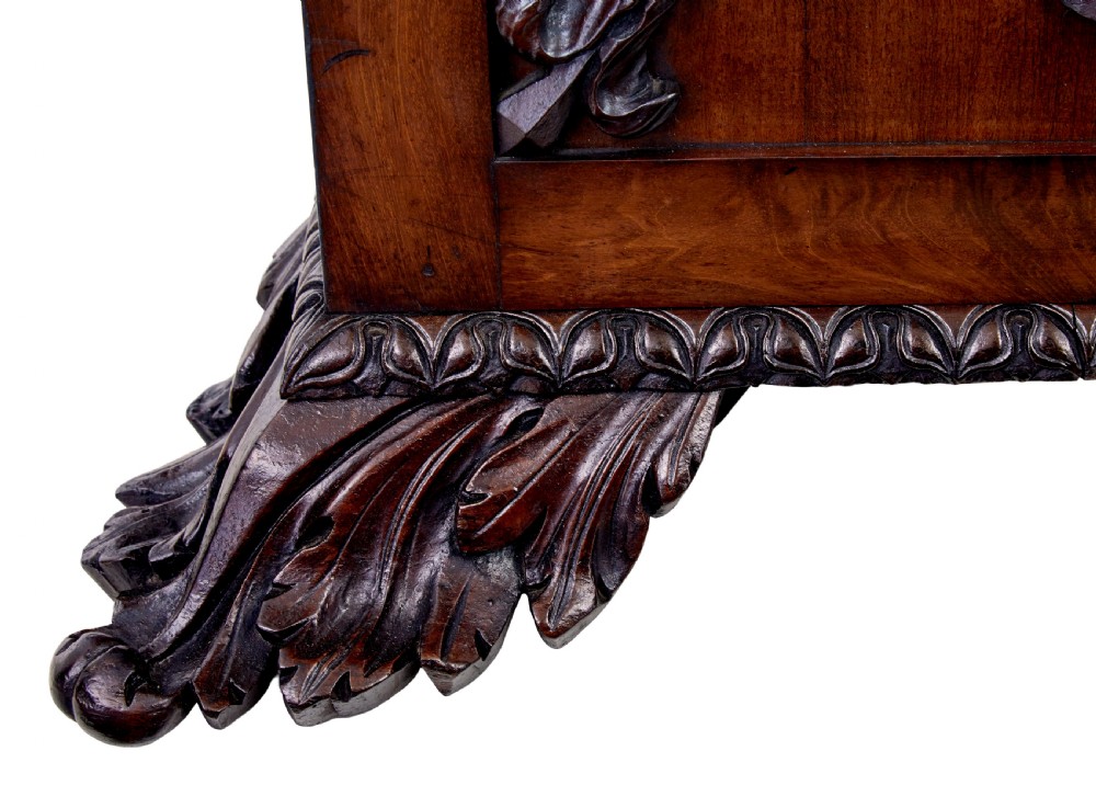 A mid-19th century Danish mahogany bookcase featuring a glazed upper display cabinet and lower doors with elaborate relief carvings. View XI