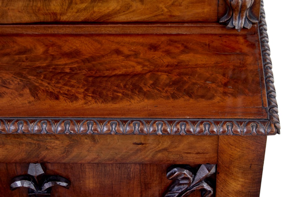 A mid-19th century Danish mahogany bookcase featuring a glazed upper display cabinet and lower doors with elaborate relief carvings. View XII