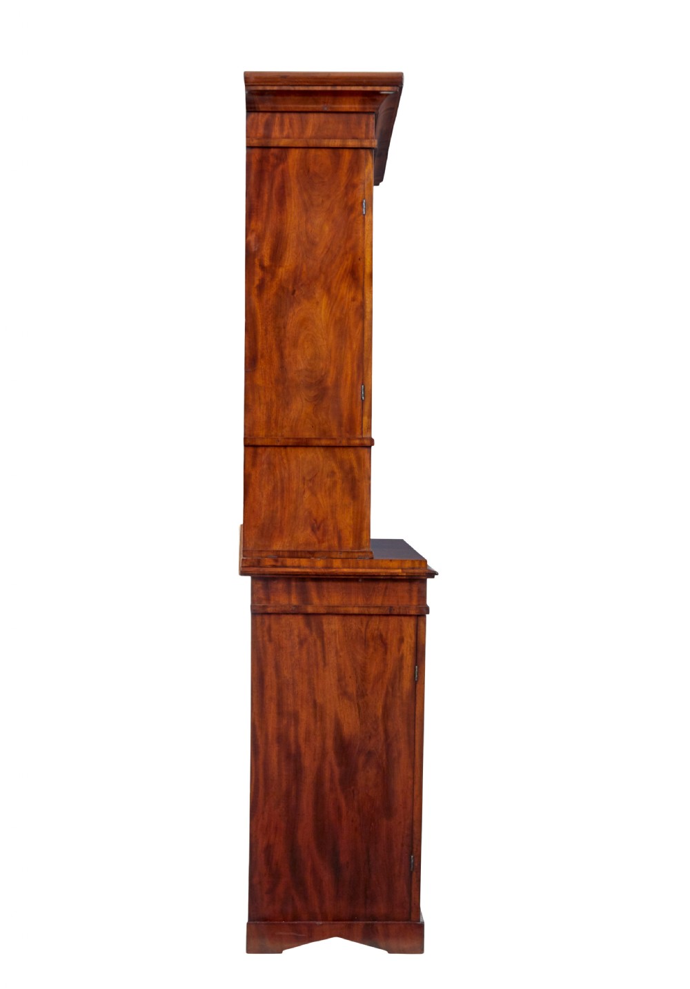 A mid-19th-century Danish flame mahogany tall cabinet featuring a carved cresting pediment, open central niche, and double cupboard doors with moulded panels. View IV
