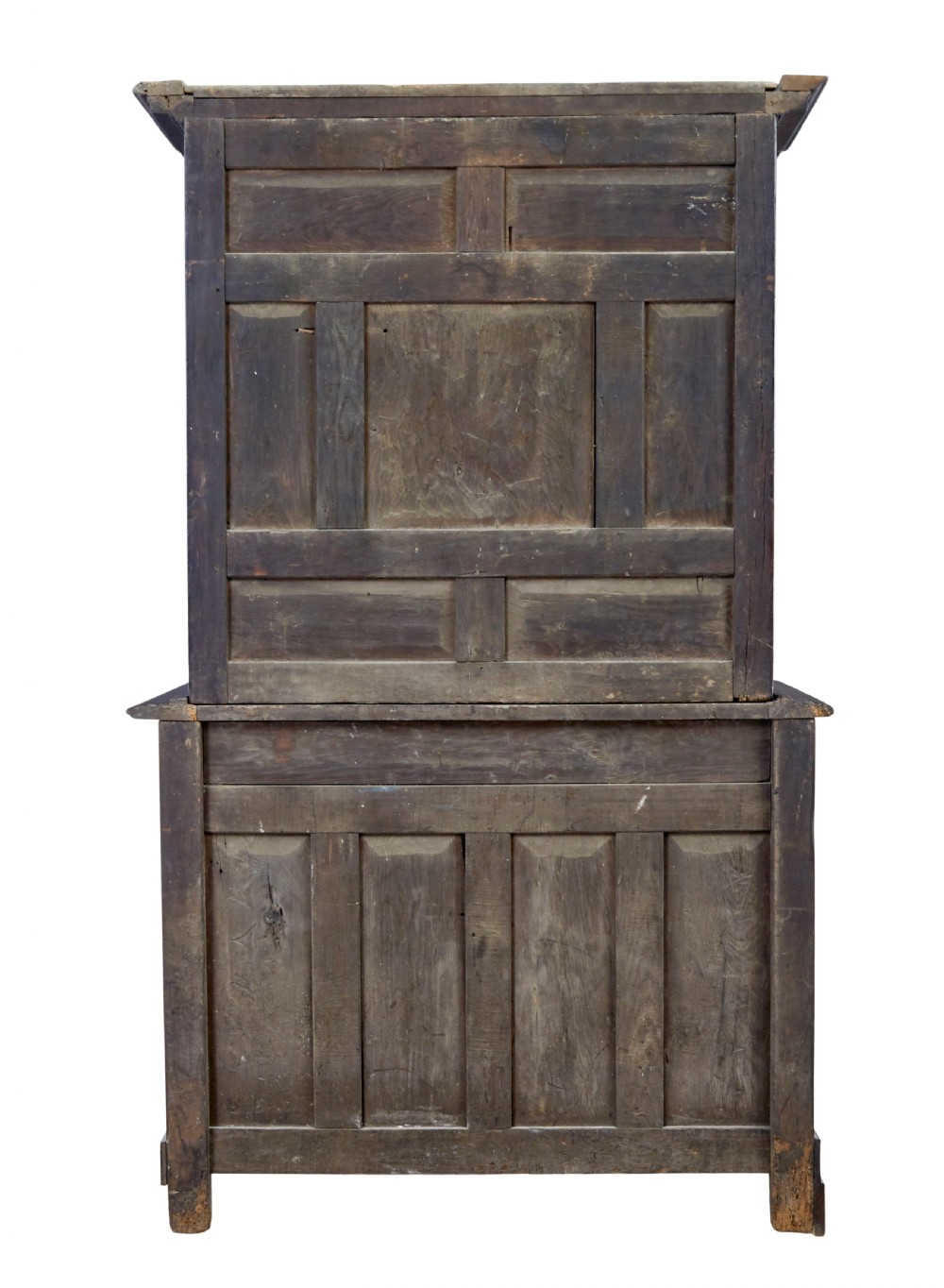 An eighteenth-century French carved walnut cupboard in two tiers featuring geometric relief panels, floral motifs, cherub carvings, and decorative steel hinges. View IV