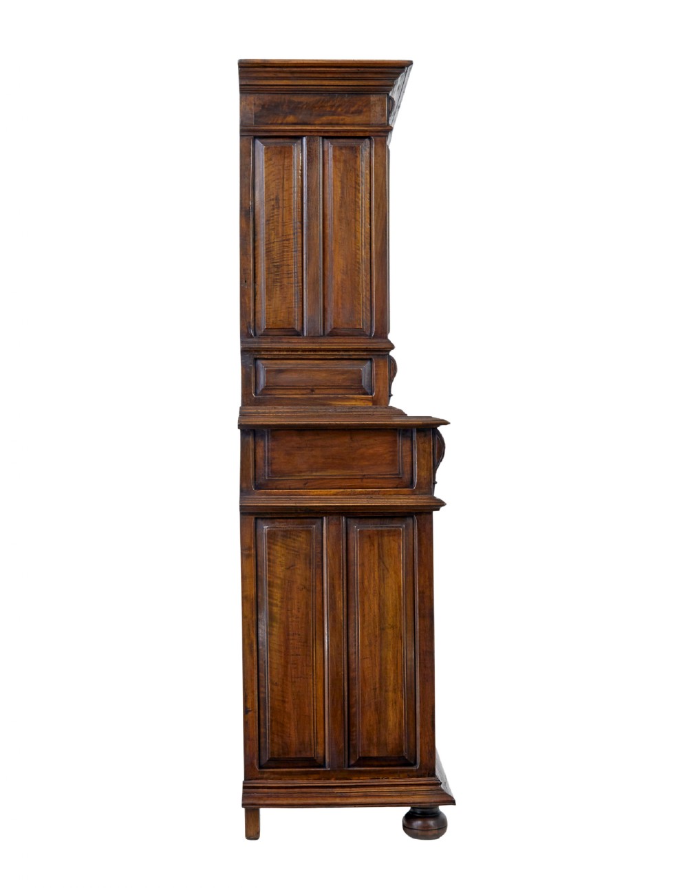 Mid 19th century dark walnut two-tiered Italian cabinet featuring intricately carved relief panels of figures, decorative drawers, and bun feet. View V