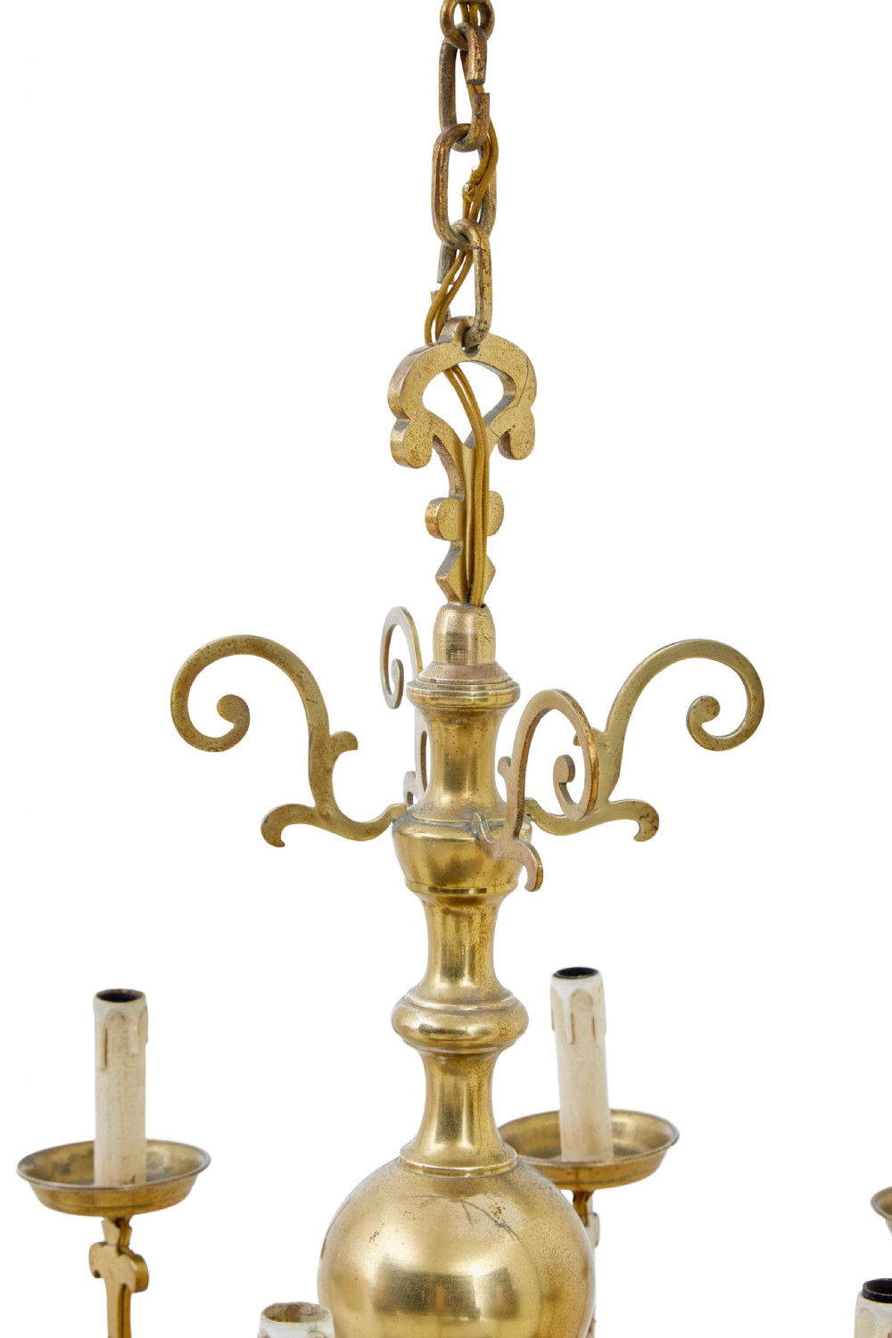 An early 20th century brass eight-arm chandelier featuring scrolling branches, circular drip pans, candle sleeves, a central baluster stem, and a suspension chain. View III
