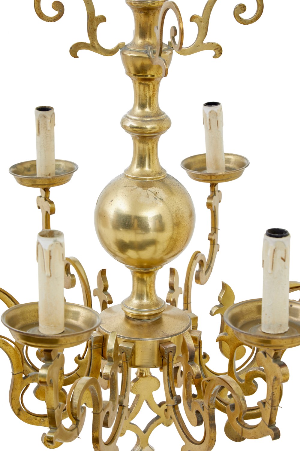 An early 20th century brass eight-arm chandelier featuring scrolling branches, circular drip pans, candle sleeves, a central baluster stem, and a suspension chain. View IV