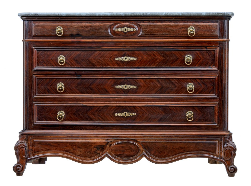 A nineteenth-century French palisander chest of drawers featuring chevron grain veneering, decorative brass drop handles, and a faux marble top.