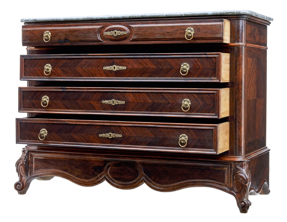 A nineteenth-century French palisander chest of drawers featuring chevron grain veneering, decorative brass drop handles, and a faux marble top. View III