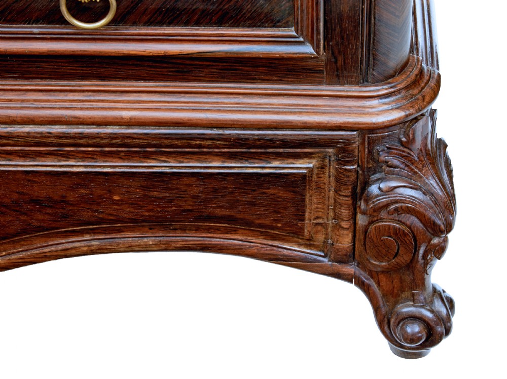 A nineteenth-century French palisander chest of drawers featuring chevron grain veneering, decorative brass drop handles, and a faux marble top. View IX