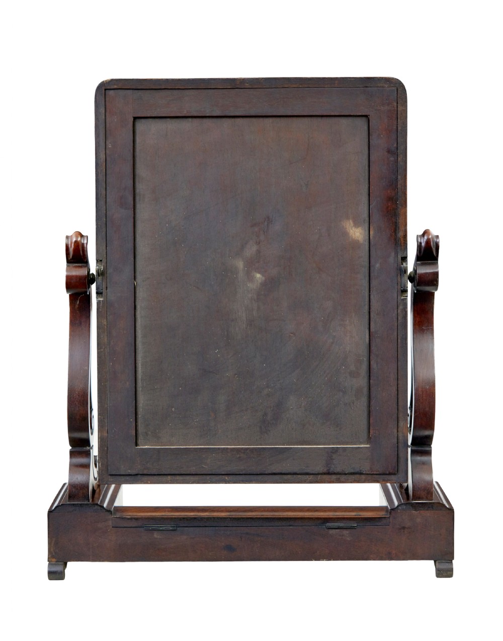 An Early Victorian mahogany toilet mirror featuring a rectangular frame set between carved scroll supports on a plinth base with scroll feet. View III