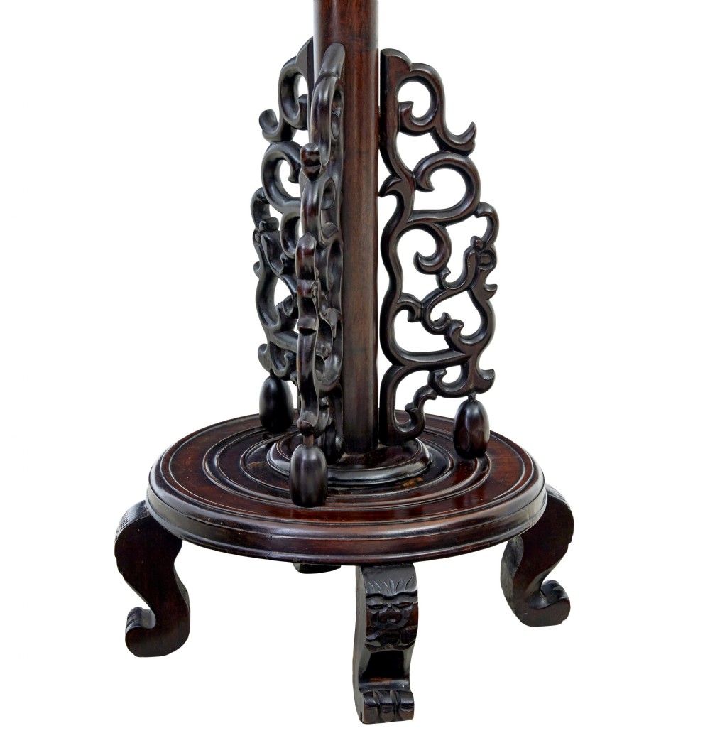 A tall dark hardwood floor lamp featuring a carved dragon head top motif and an openwork carved base with cabriole feet. View IV