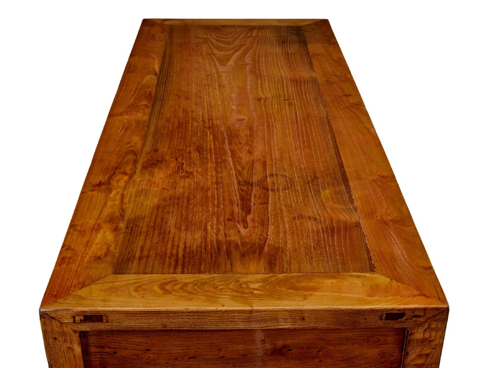 A 19th-century Chinese carved elm console table featuring three drawers with brass handles, carved corner spandrels, and square legs. View VIII