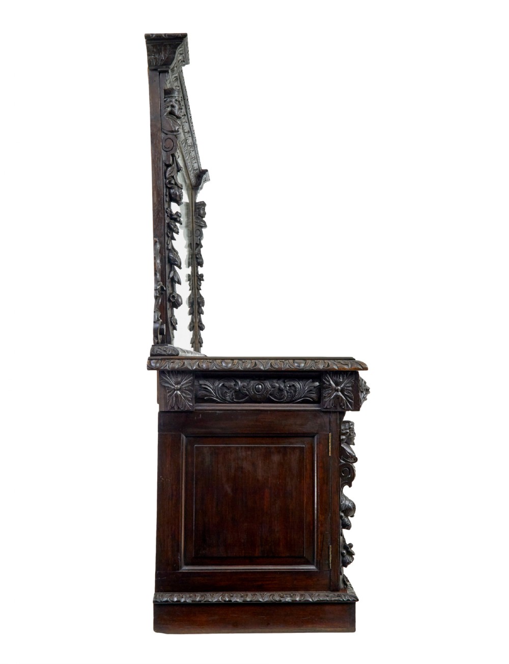 A 19th-century dark oak sideboard featuring twin carved pedestal cupboards, relief fruit swags, and an upper mirrored frame superstructure. View VII