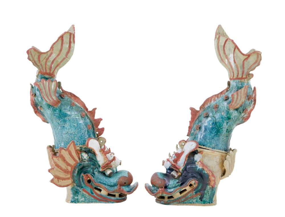 A pair of 19th-century Japanese glazed ceramic Shachihoko roof ornaments depicting dragon-headed carp with raised tails in green, red, and cream glazes. View III