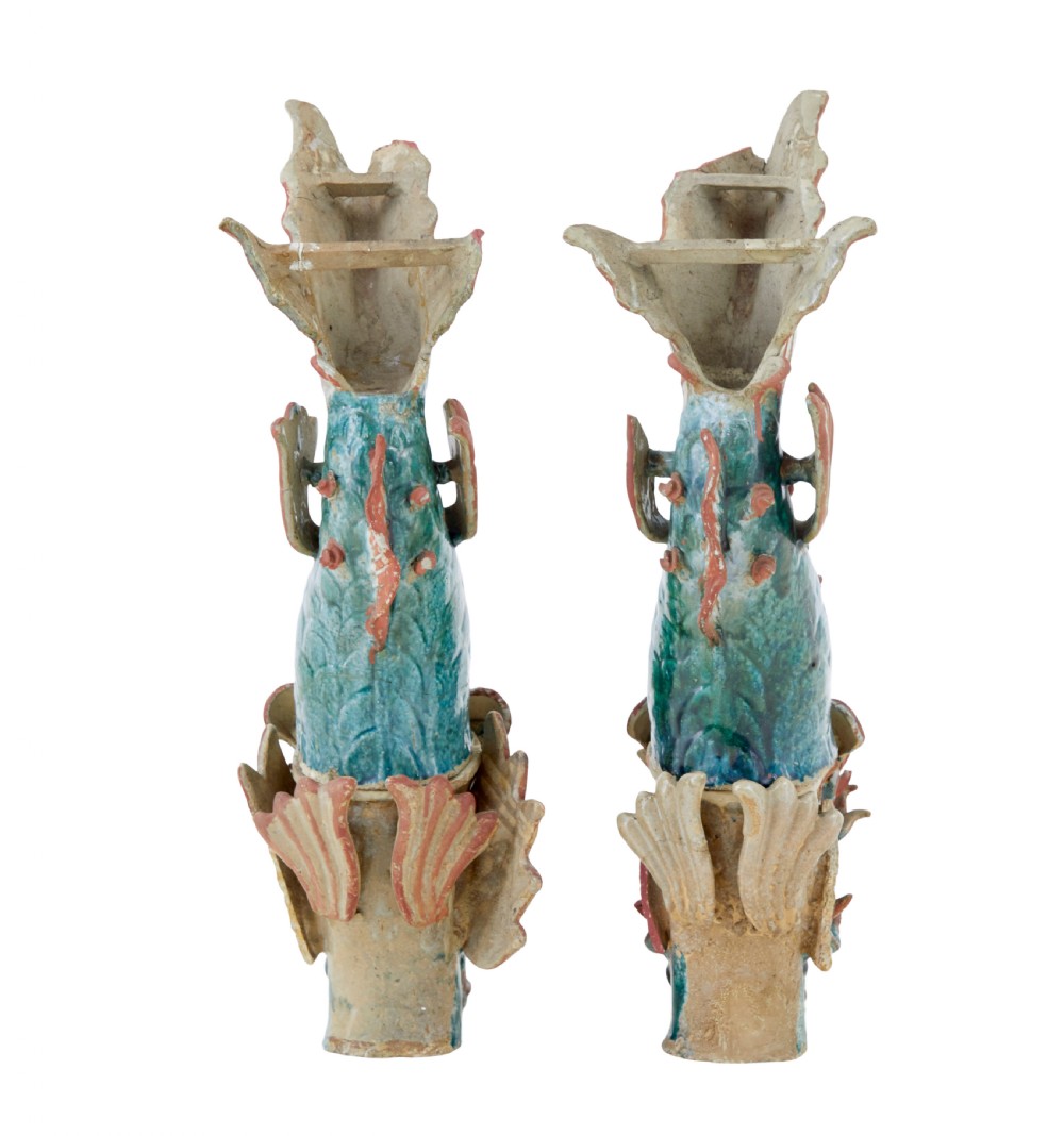 A pair of 19th-century Japanese glazed ceramic Shachihoko roof ornaments depicting dragon-headed carp with raised tails in green, red, and cream glazes. View V