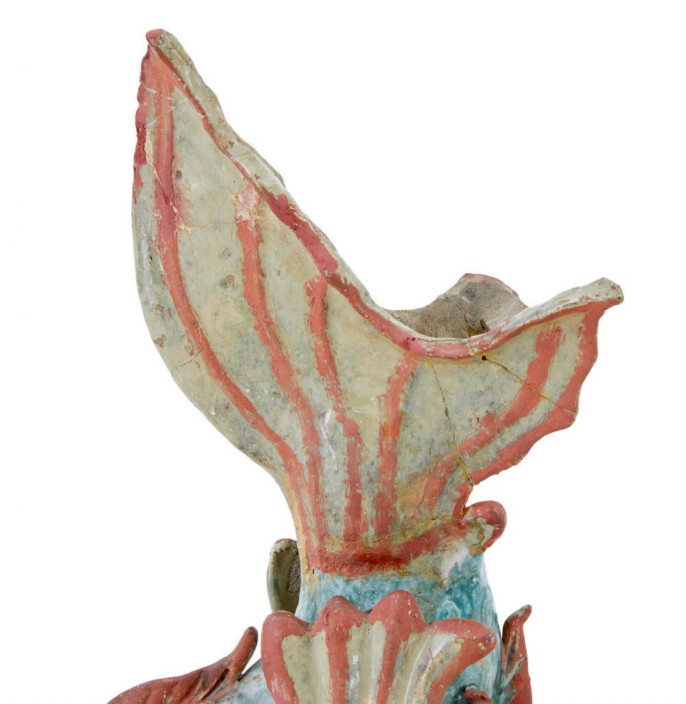 A pair of 19th-century Japanese glazed ceramic Shachihoko roof ornaments depicting dragon-headed carp with raised tails in green, red, and cream glazes. View IX