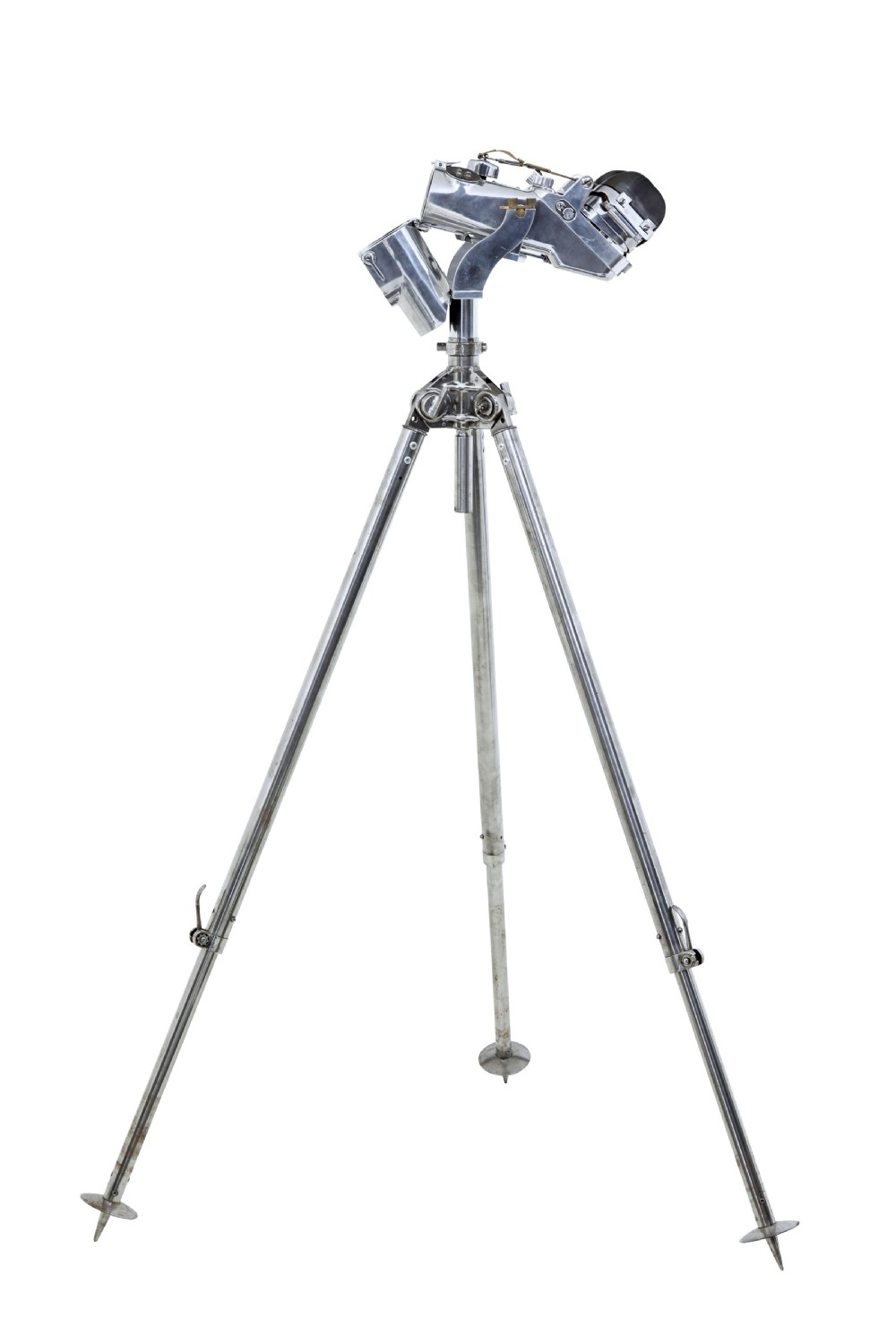 A pair of polished steel military binoculars mounted on a tall three-legged metal tripod stand against a plain background. View XIV