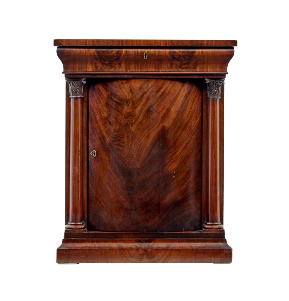 A tall mid 19th-century Danish Empire mahogany pier mirror resting on a matching single-door base cabinet featuring classical column supports. View IX