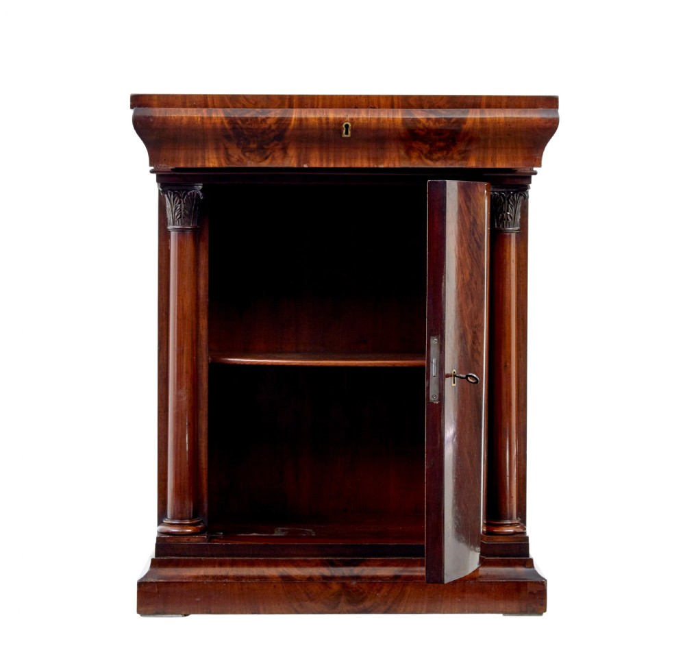 A tall mid 19th-century Danish Empire mahogany pier mirror resting on a matching single-door base cabinet featuring classical column supports. View X