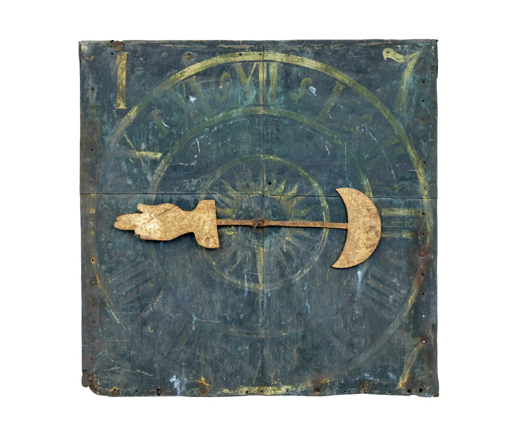 A square 18th-century Swedish copper turret clock face featuring a green verdigris patina, central sunburst motif, Roman numerals, and a single hand shaped like a pointer.