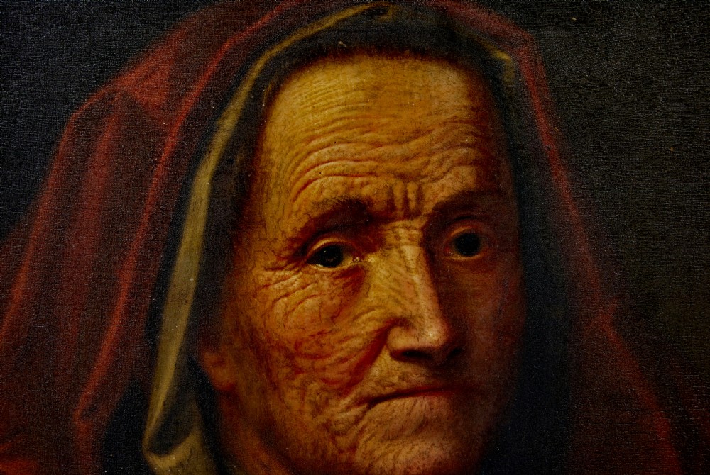 An 18th-century oil portrait depicting an elderly woman with a red hood, housed in a heavily carved gold gilt frame. View VI