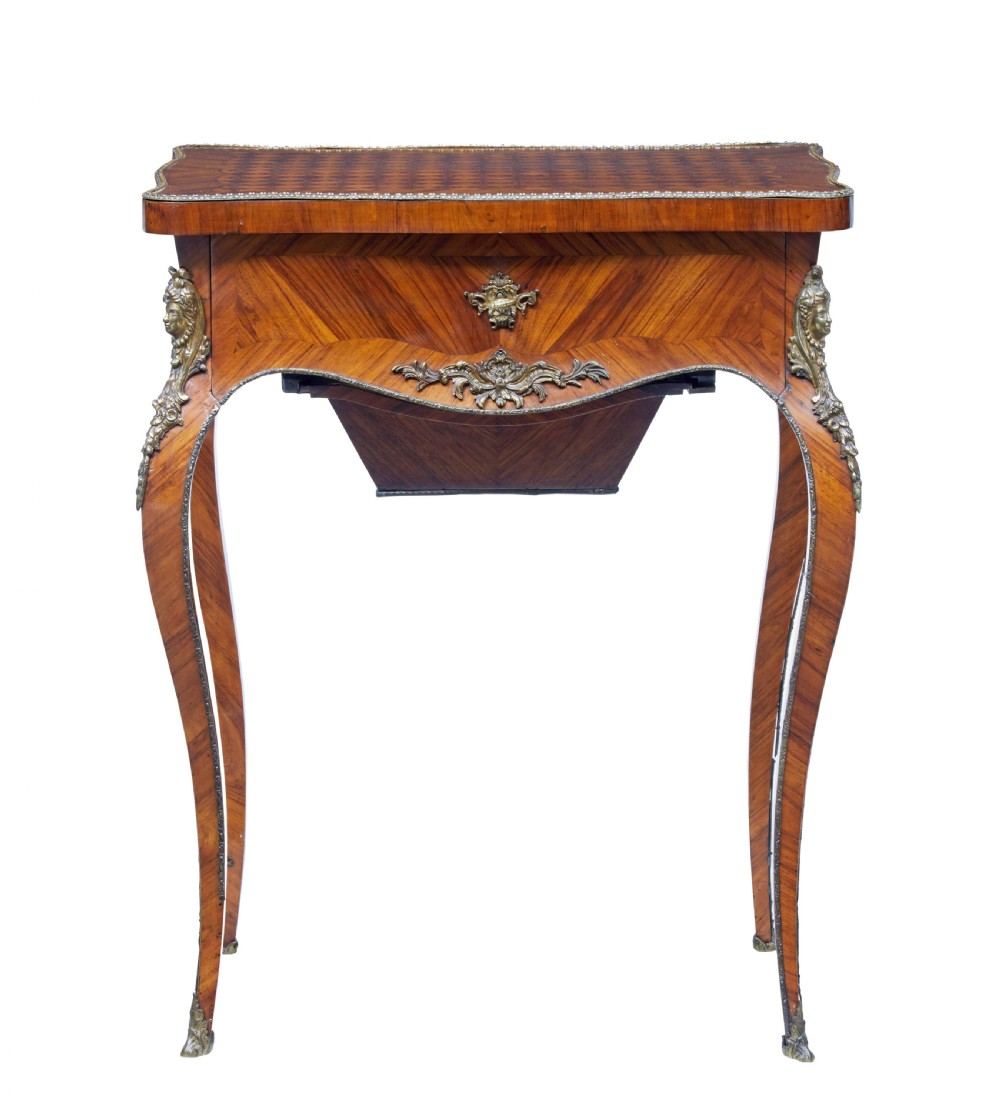 A 19th-century French kingwood sewing work table featuring parquetry veneering, cabriole legs, gilt-bronze mounts, and a lower fabric-lined storage bin. View II