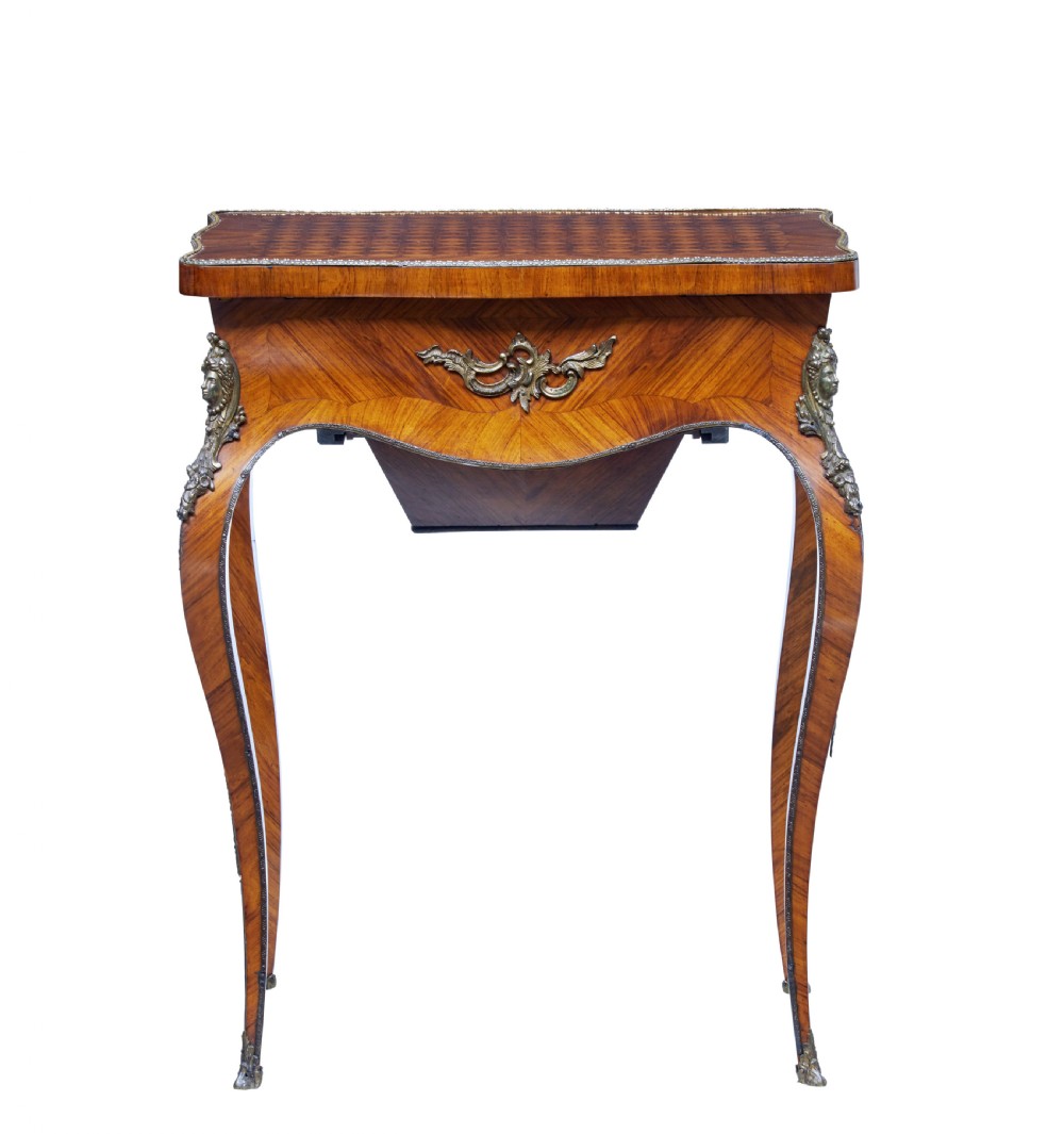 A 19th-century French kingwood sewing work table featuring parquetry veneering, cabriole legs, gilt-bronze mounts, and a lower fabric-lined storage bin. View V