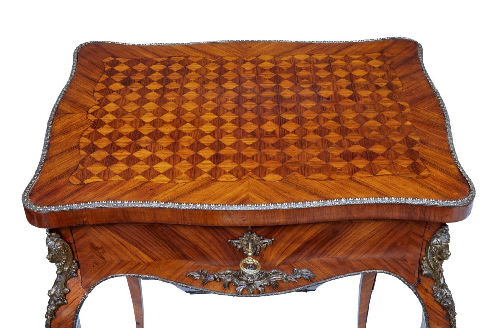 A 19th-century French kingwood sewing work table featuring parquetry veneering, cabriole legs, gilt-bronze mounts, and a lower fabric-lined storage bin. View VI