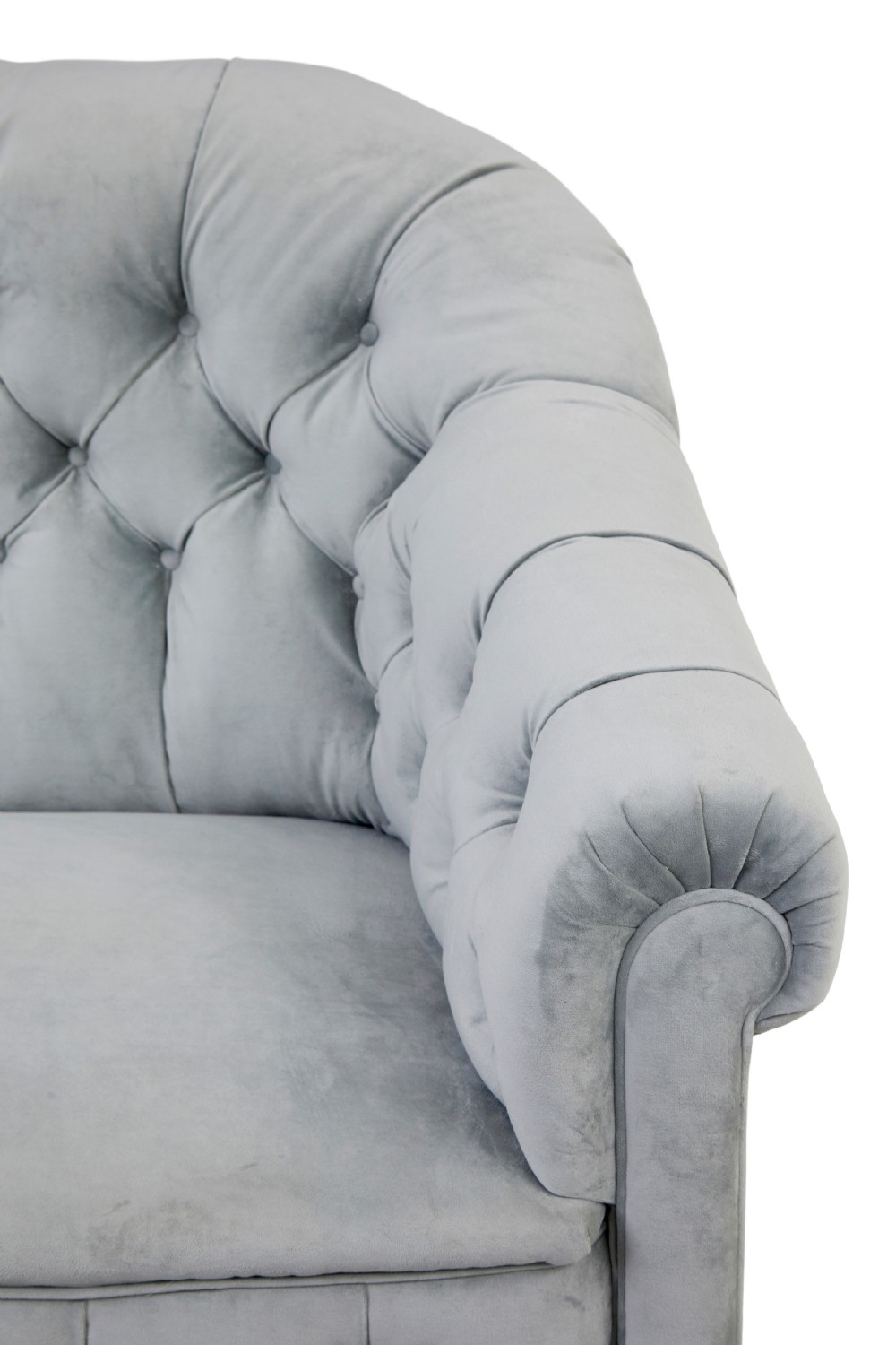 An early 20th-century three-piece suite comprising a two-seater sofa and two matching armchairs upholstered in light grey deep-buttoned velvet with tapered wooden legs. View VIII