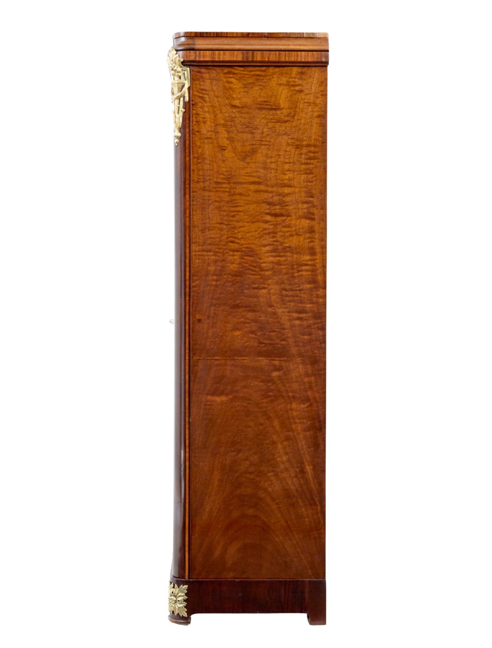 A nineteenth-century French Empire style mahogany cabinet featuring decorative ormolu mounts, a central brass wire mesh door, and outer panelled doors with shell inlays. View IV