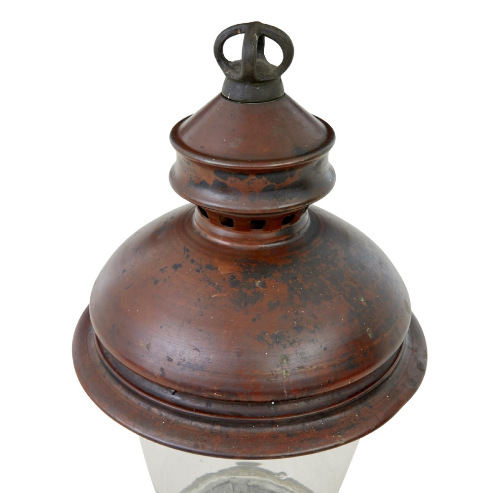 A 19th-century French copper street lantern featuring a conical copper roof with a crown finial and a tapered clear glass shade above a dark metal base. View V