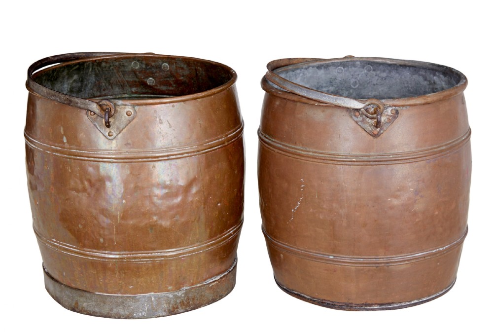 A near pair of late 19th-century cylindrical copper buckets featuring hand-hammered surfaces, reeded metal bands, and dark iron swing handles. View III