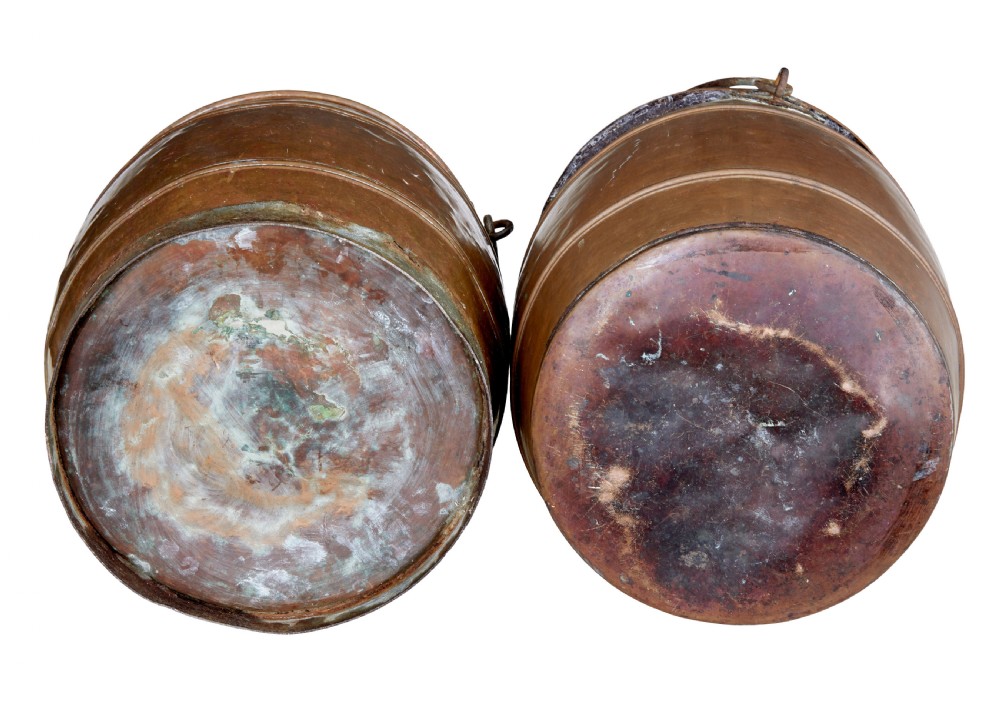 A near pair of late 19th-century cylindrical copper buckets featuring hand-hammered surfaces, reeded metal bands, and dark iron swing handles. View IV