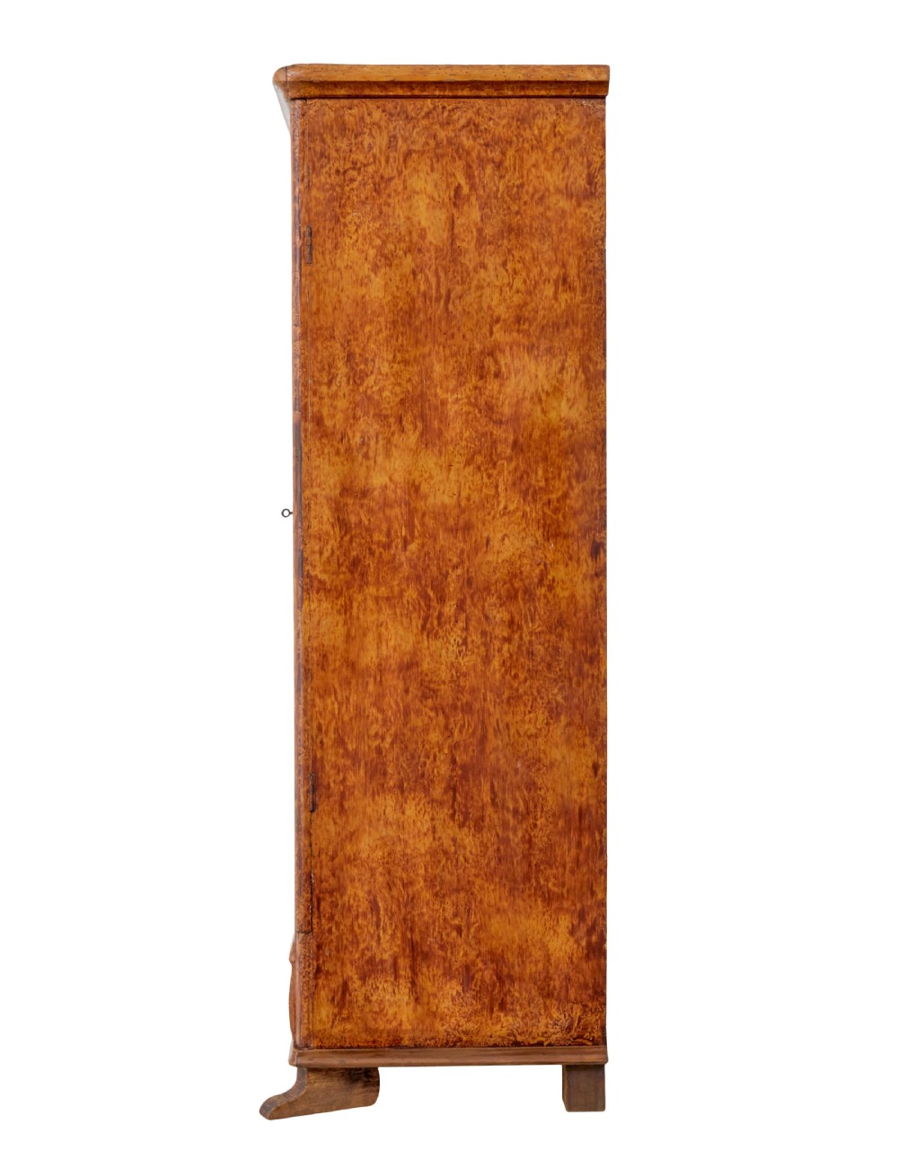 A 19th-century Swedish pine cupboard featuring two panelled doors with a warm amber rag-painted finish and scalloped moulding detailing. View VII