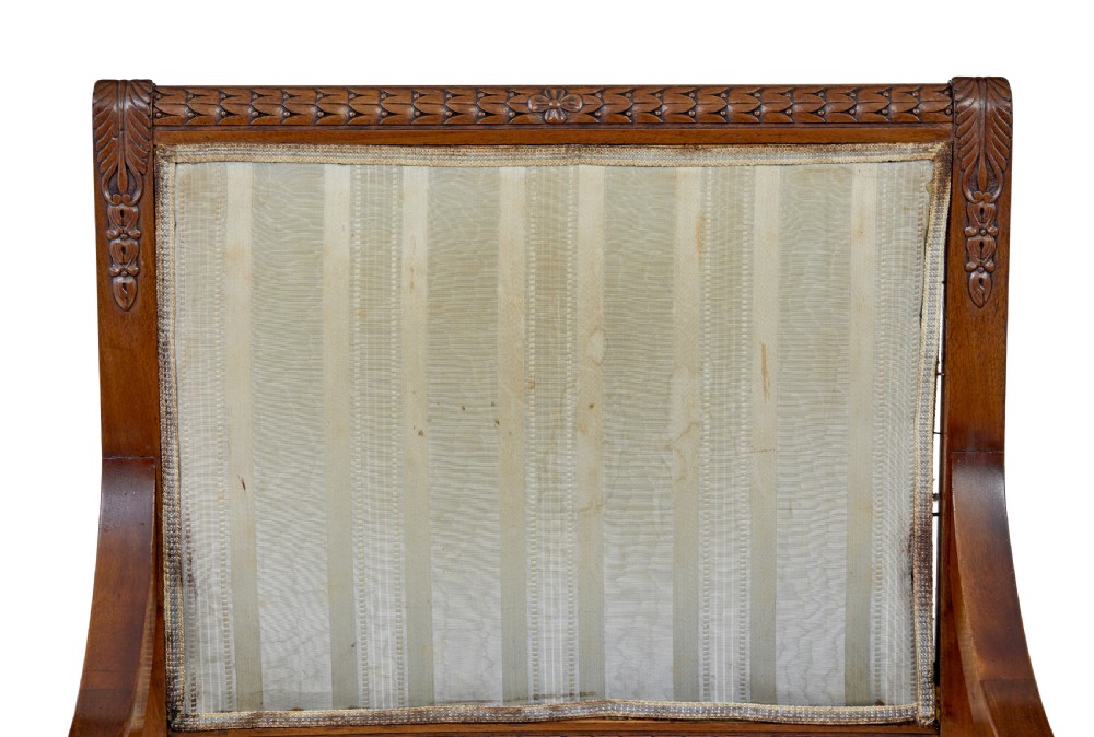 An early twentieth-century seven-piece Empire Revival walnut salon suite comprising a bench, two armchairs, and four side chairs with carved serpent back splats. View IX