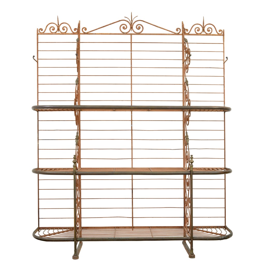 An early 20th-century French wrought iron and brass bakers rack featuring decorative scrollwork and three open slatted shelves. View II