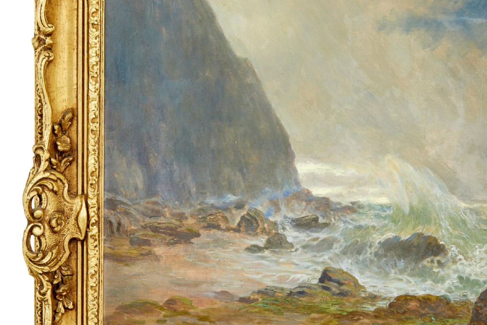 A 19th-century framed oil painting depicting three women gathering shellfish along a rocky, wave-swept coastline set within an ornate gilded frame. View IV