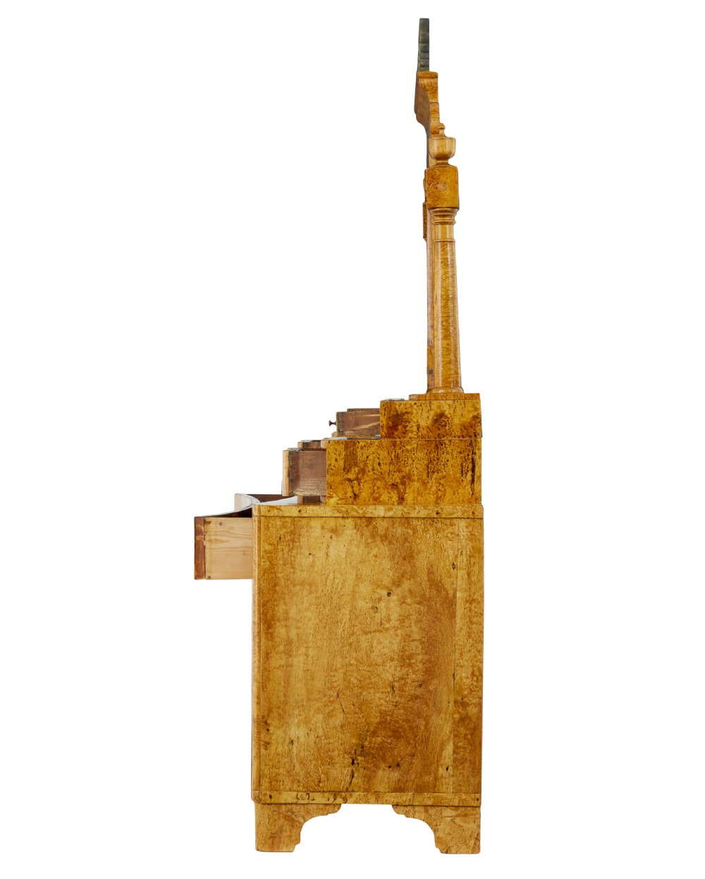 An early 19th-century Biedermeier vanity cabinet featuring a central framed mirror, stepped tier of small drawers, and a double-door base in figured golden birch timber. View IV