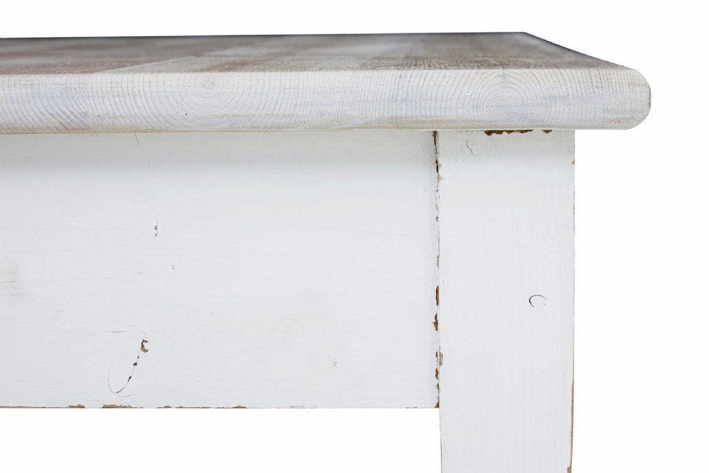A large square Swedish nineteenth-century kitchen table featuring a natural scrubbed pine plank top and a white painted frame with square tapered legs. View II
