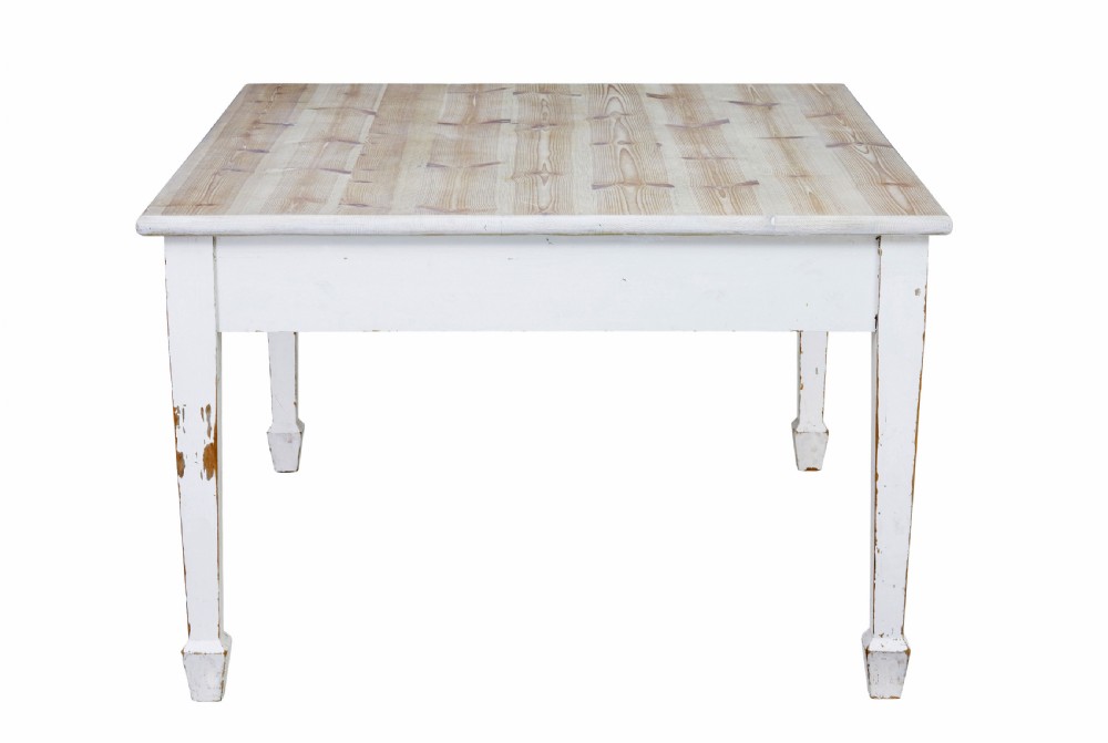 A large square Swedish nineteenth-century kitchen table featuring a natural scrubbed pine plank top and a white painted frame with square tapered legs. View VIII