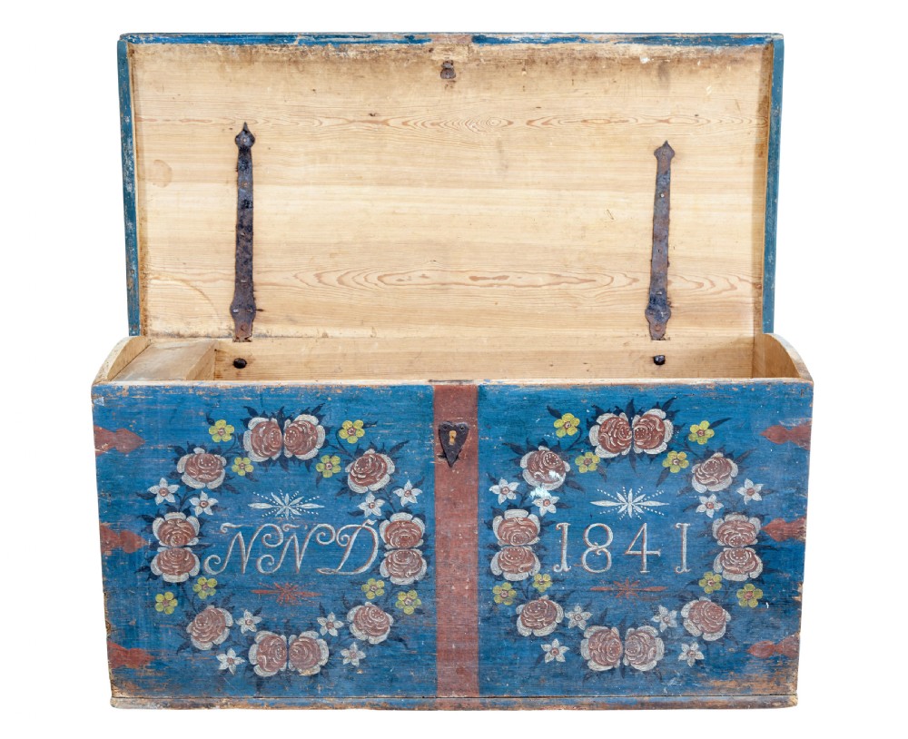 A 19th-century Swedish blue-painted pine coffer featuring hand-painted floral wreaths, a keyhole escutcheon, the date 1841, and initials NND. View II