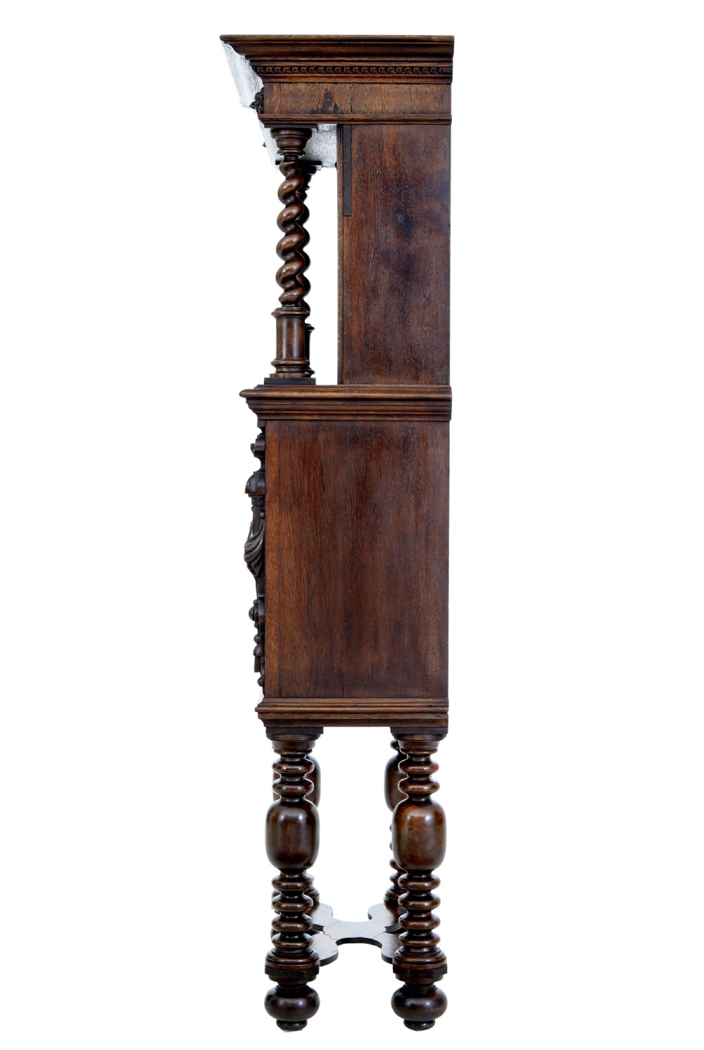 A nineteenth-century Flemish carved oak hall cupboard featuring an upper open niche framed by spiral columns above a single relief-carved door mounted on turned legs. View VI