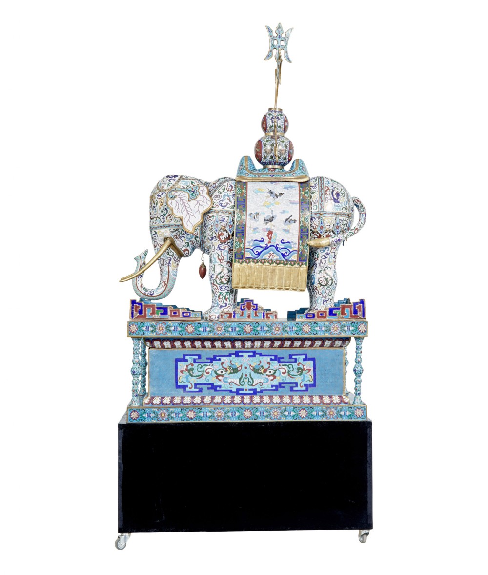 An ornate Chinese cloisonne enamel elephant sculpture with a decorated saddle blanket, standing atop a matching enamel pedestal base. View III