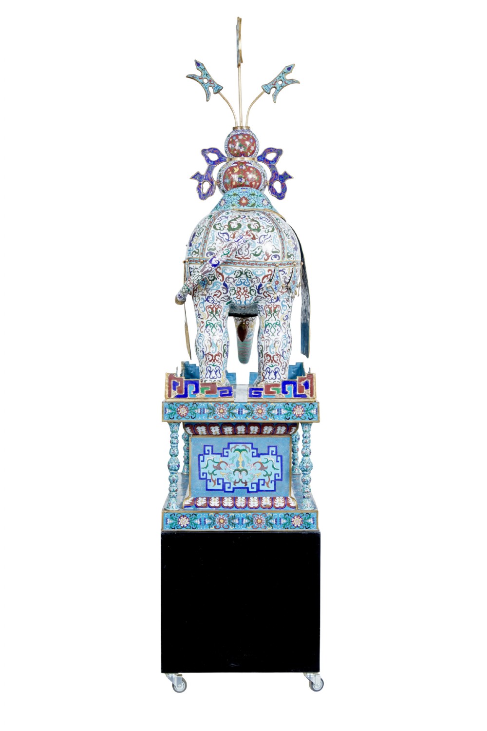 An ornate Chinese cloisonne enamel elephant sculpture with a decorated saddle blanket, standing atop a matching enamel pedestal base. View IV
